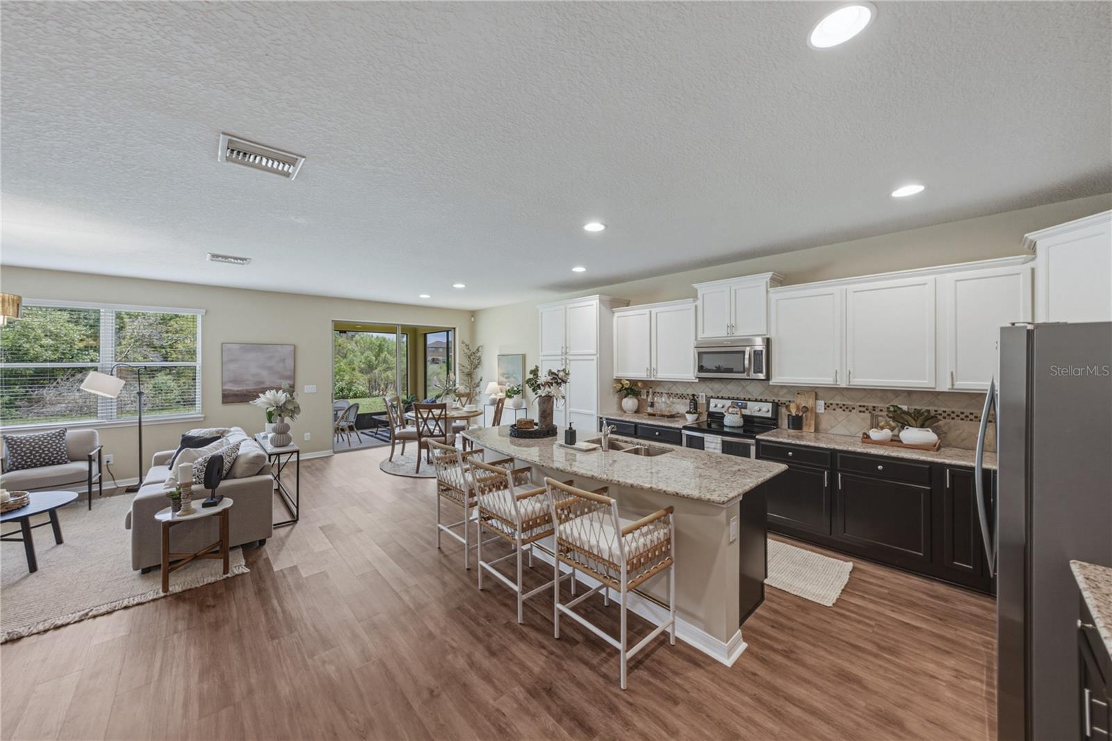 Gourmet Kitchen with 2 Tone Solid Wood  Cabinets with Beautiful LVP Floors