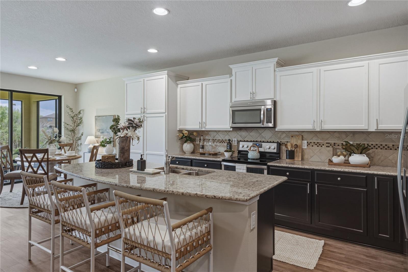 Gourmet Kitchen with 2 Tone Solid Wood Cabinets and Built in Pantry