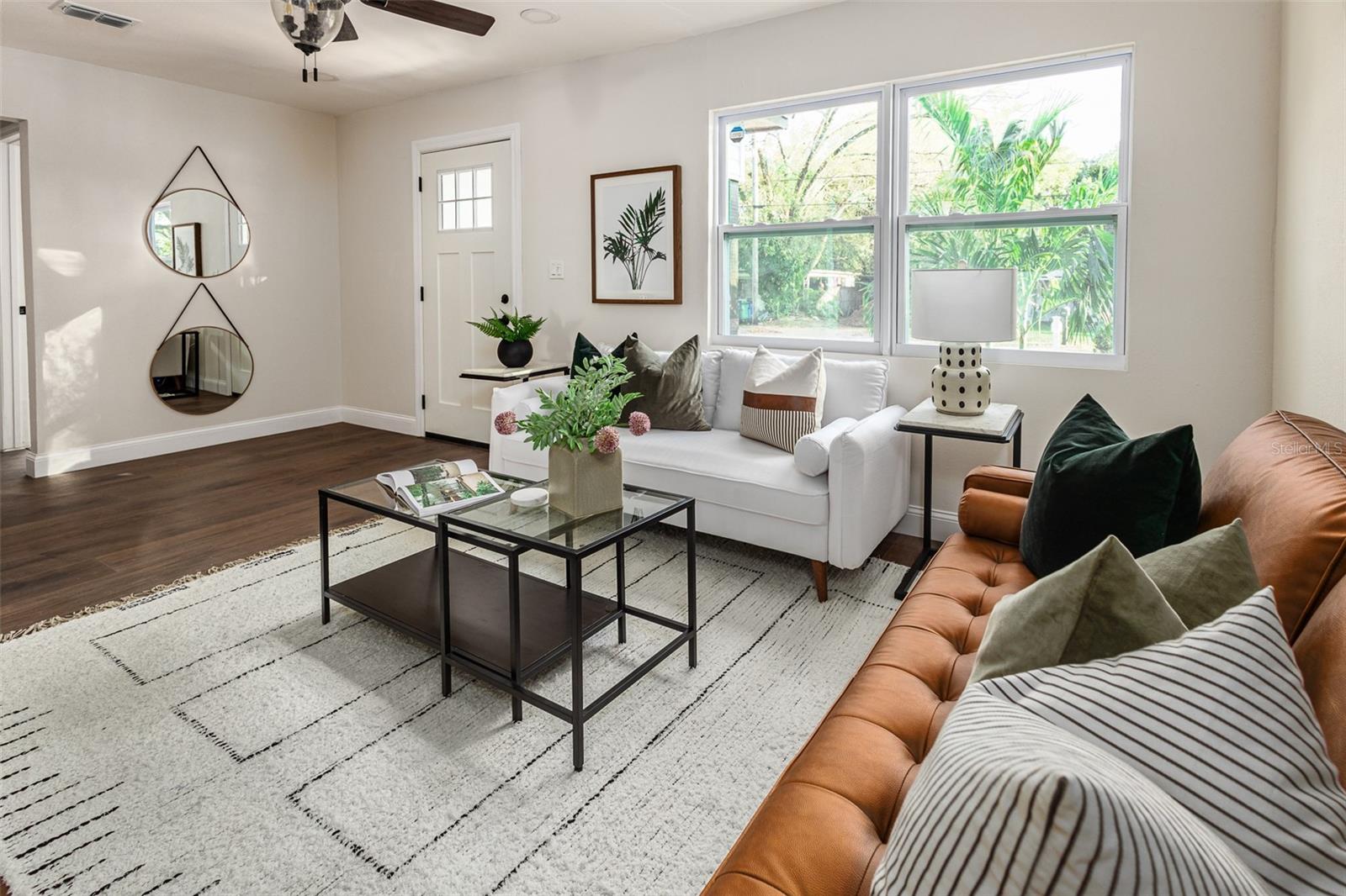Previously staged living room coming in from the front door