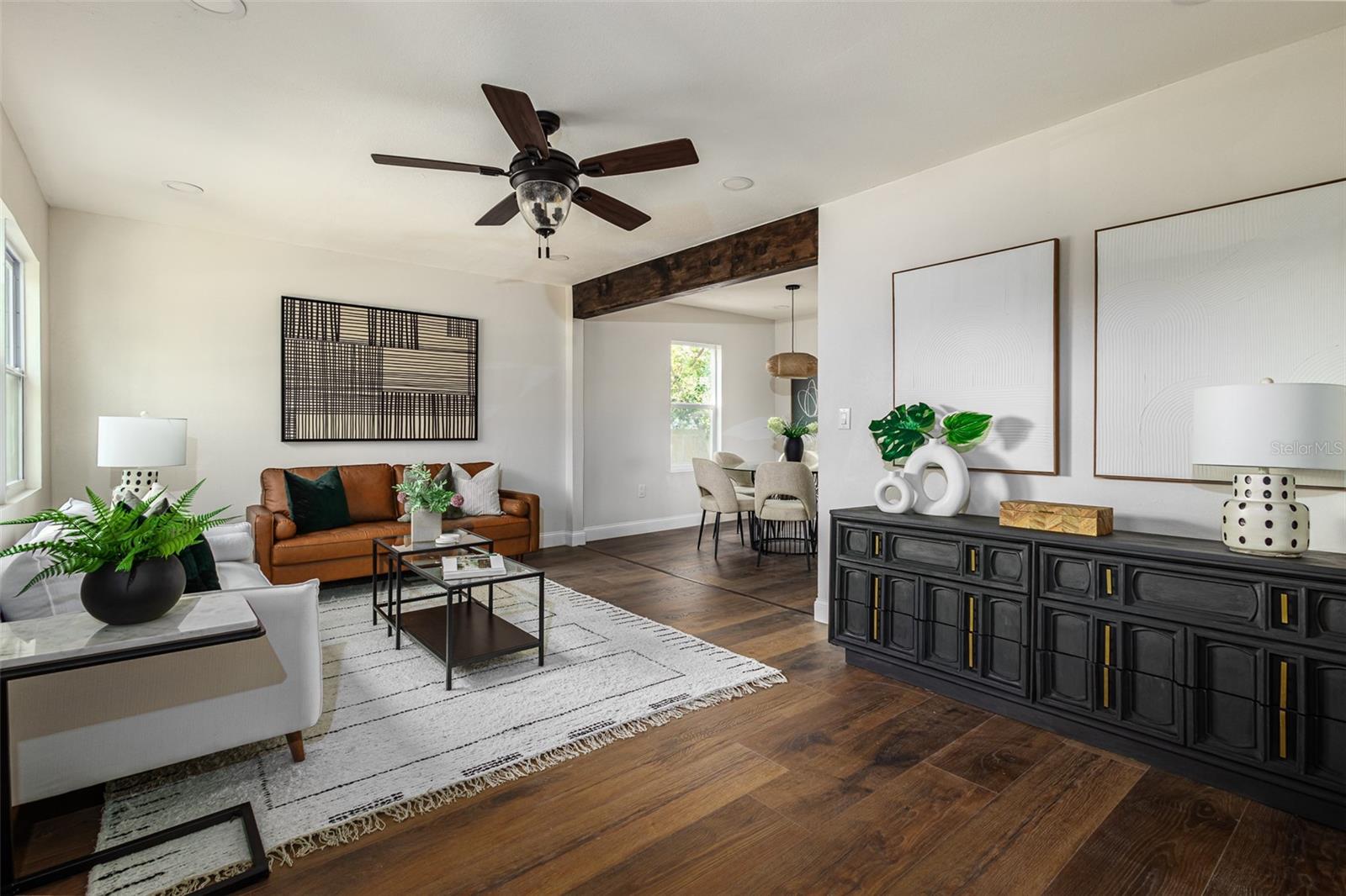 Living room leads to the dining and kitchen