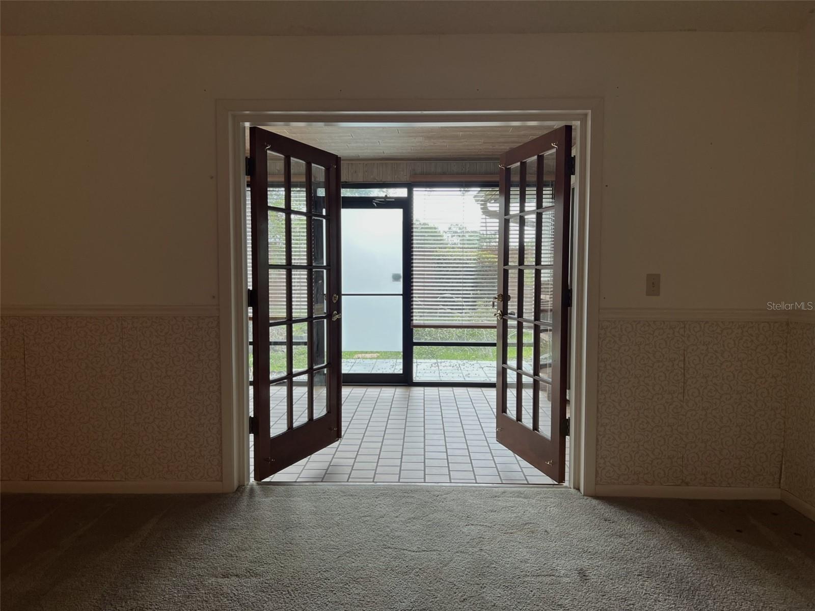 living room French doors to 4 season patio