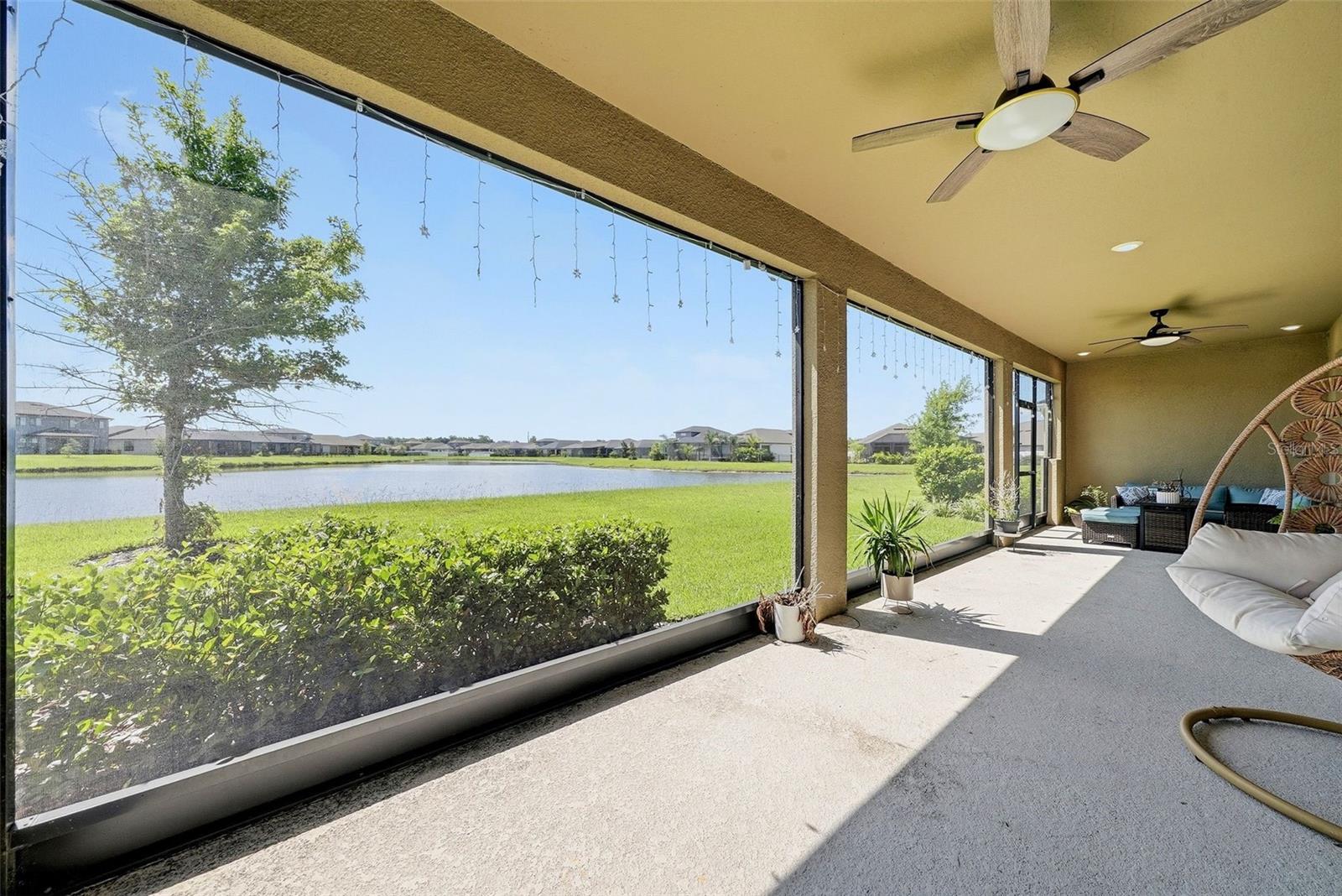 Large screened-in lanai featuring a spacious outdoor living area.