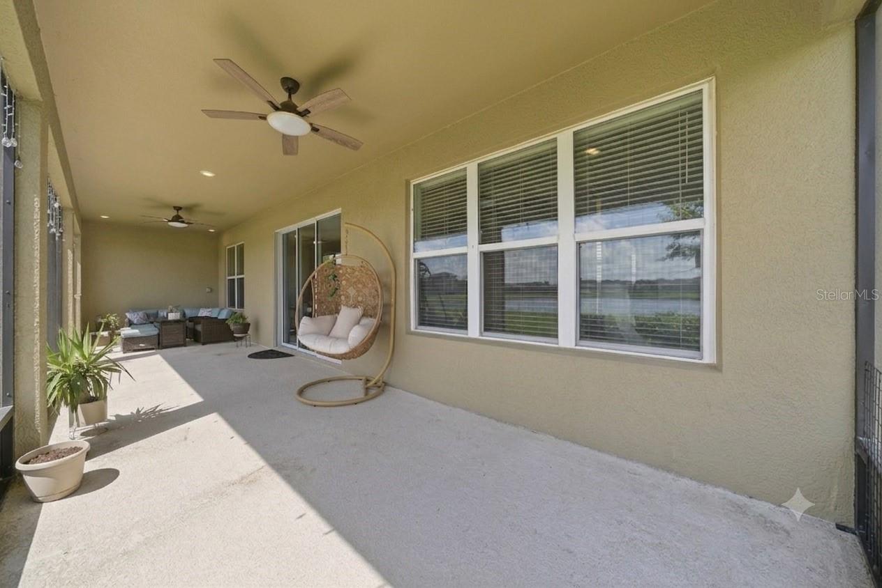 Large screened-in lanai featuring a spacious outdoor living area.