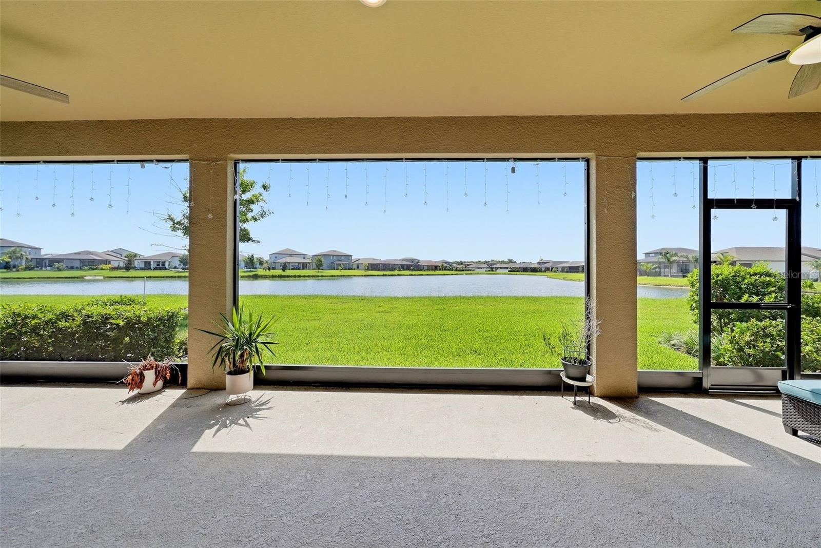 Large screened-in lanai featuring a spacious outdoor living area.