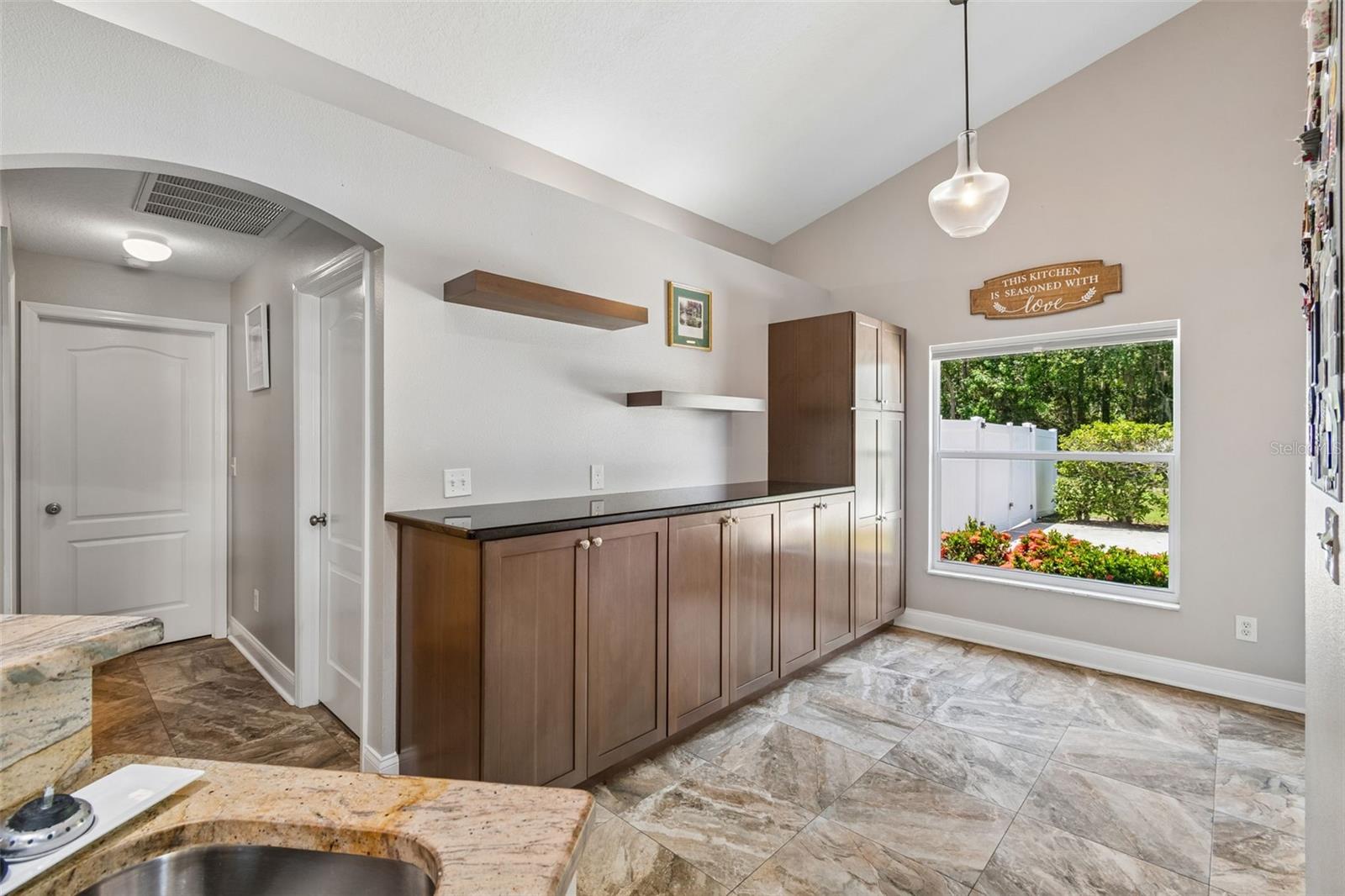 Dinette area with additional cabinets & countertop perfect for a coffee bar!