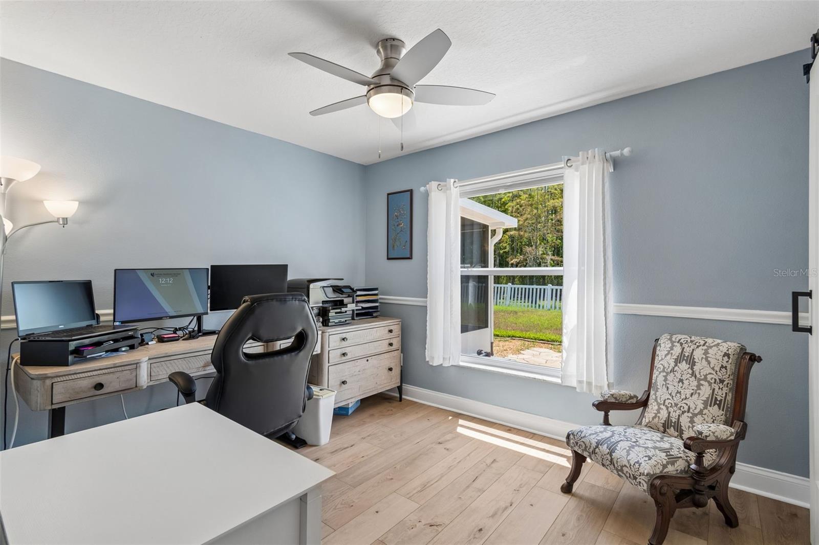 Bedroom 3 with walk-in closet & chair rail molding.