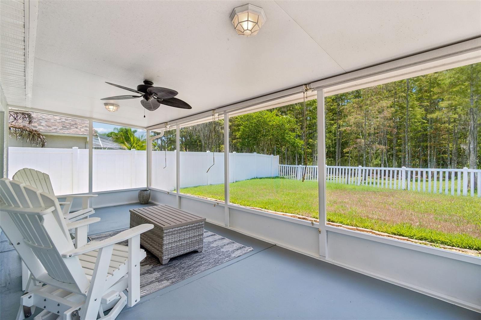 Spacious 23x10 screened back porch with conservation views!