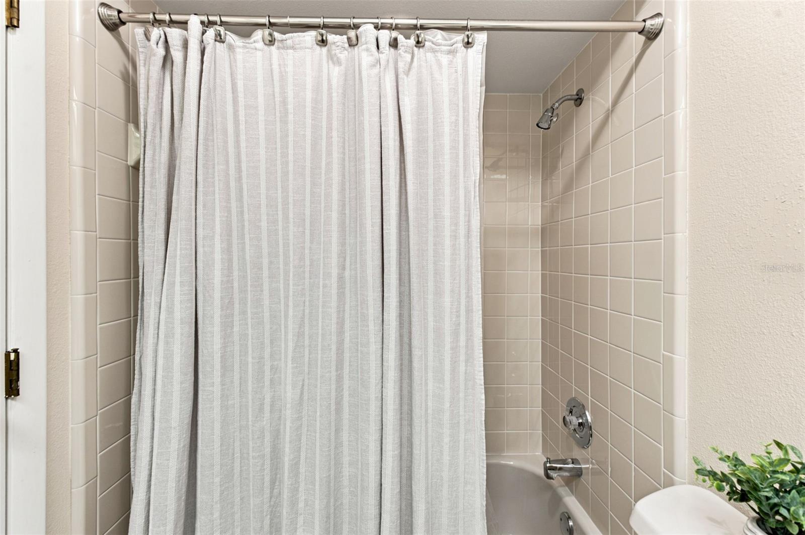 Guest bathroom tub/shower combo.