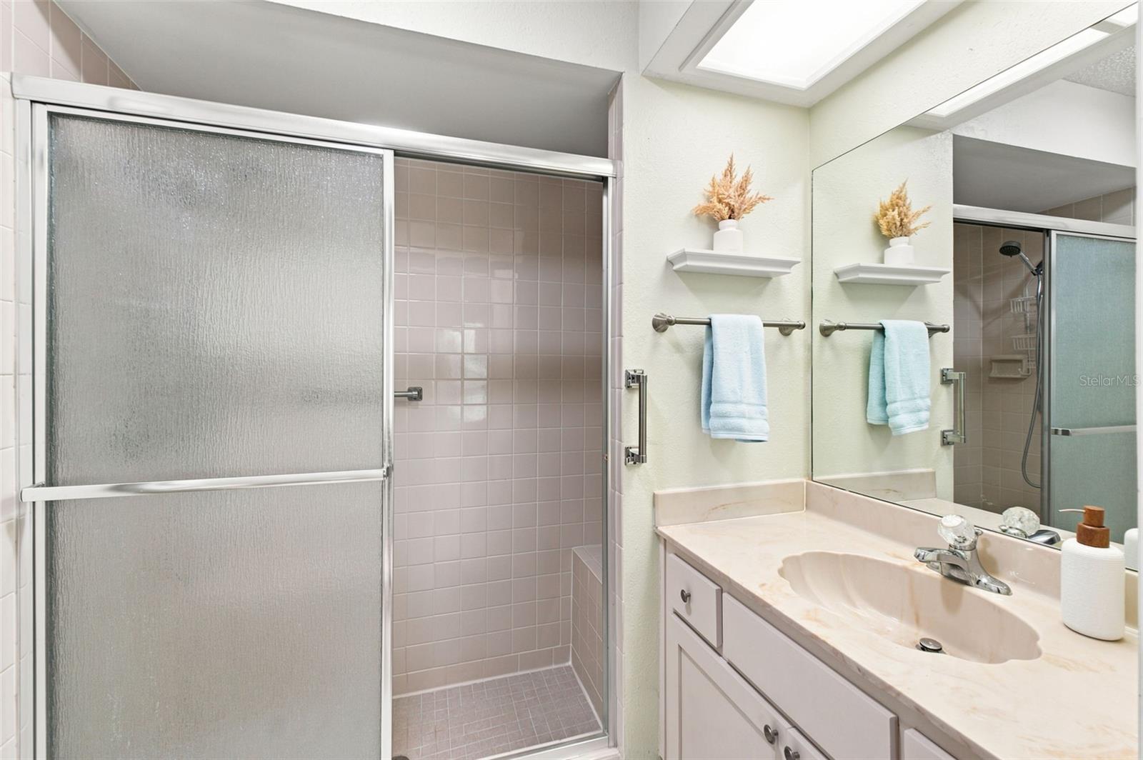 Primary bathroom with step in shower.