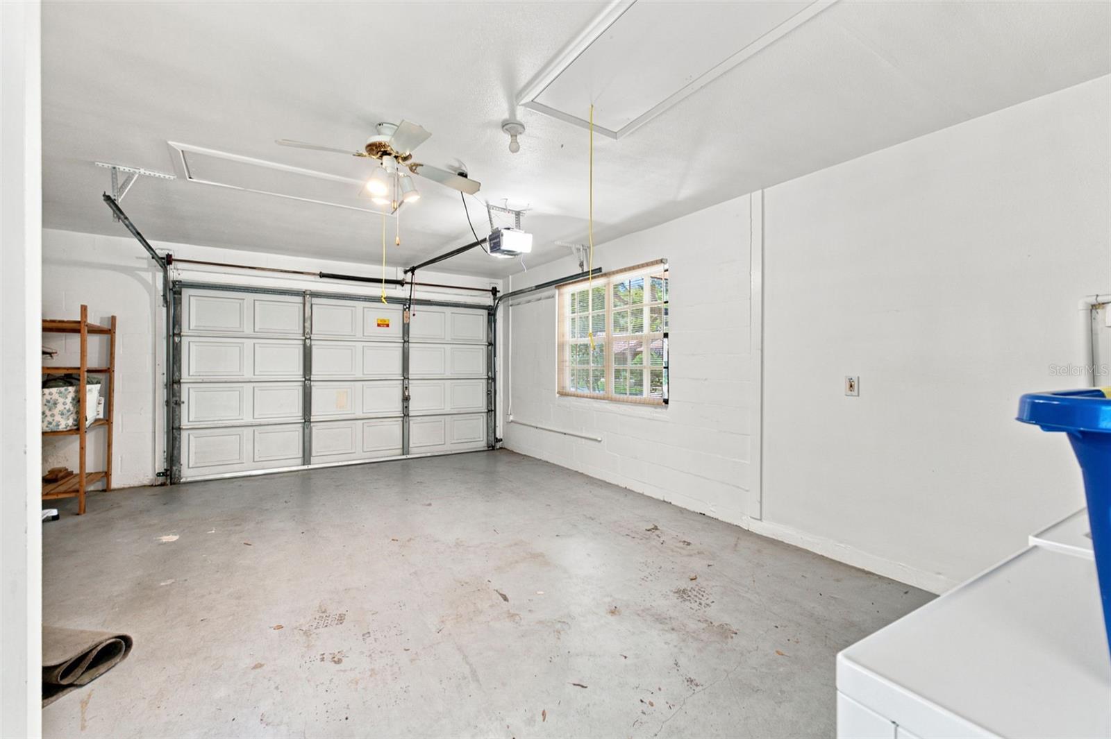 Oversized garage with potential to fit golf cart in addition to vehicle.