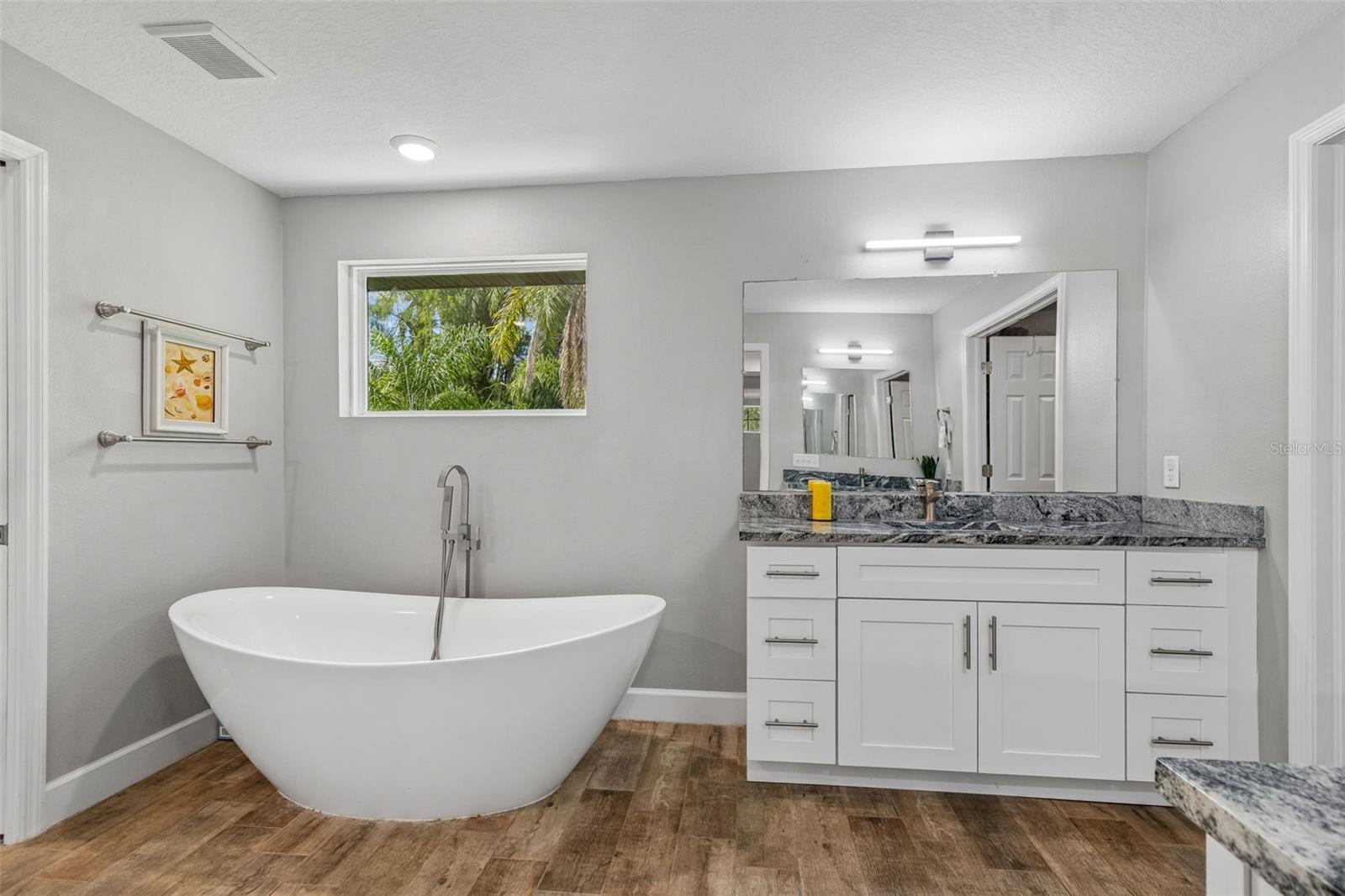 Primary bathroom with separate vanities