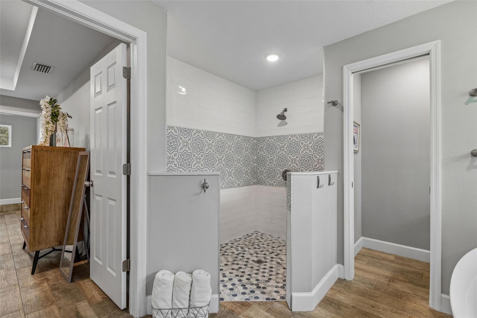 Large walk in shower with custom tile work