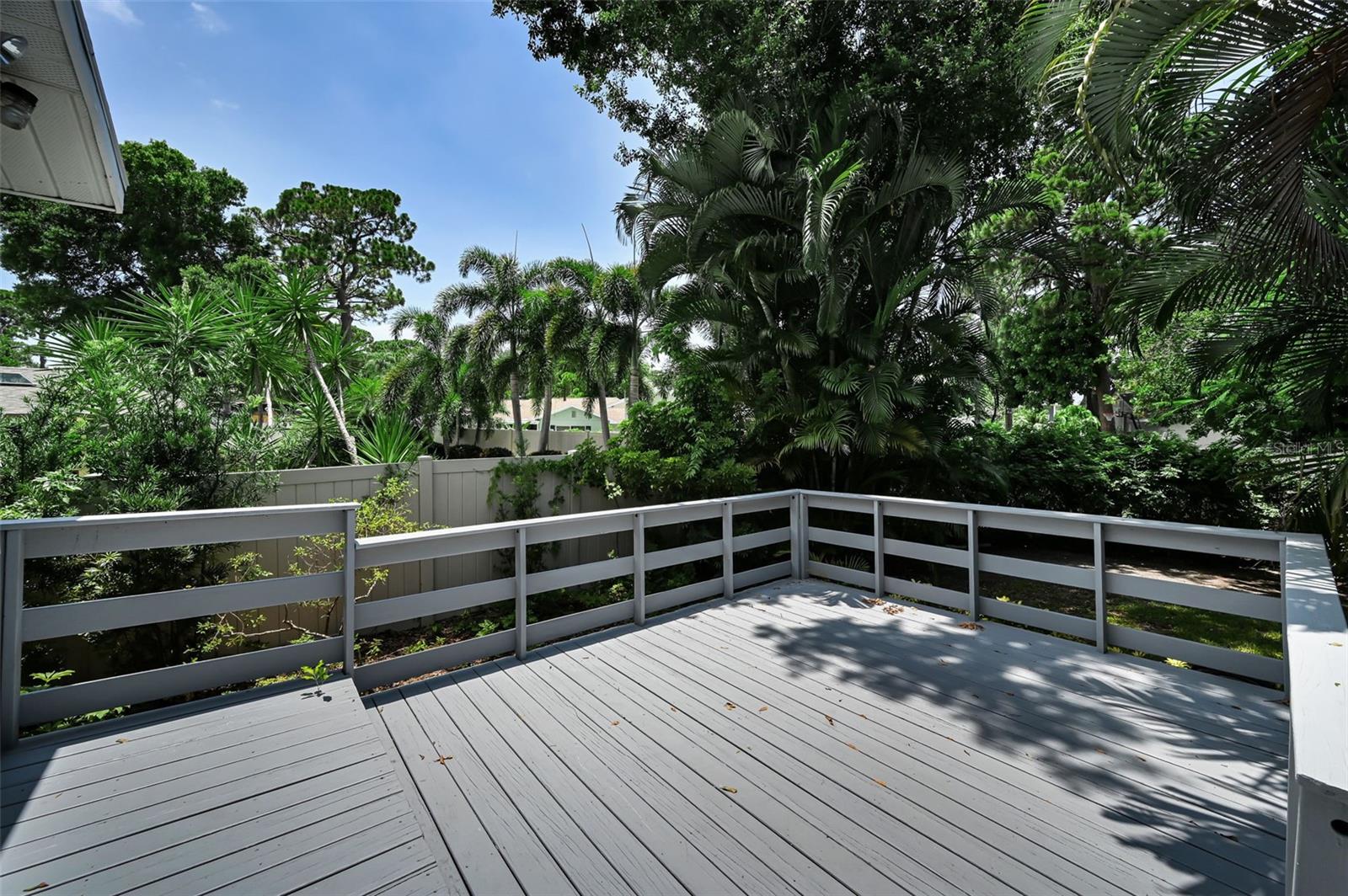 Step out onto your private elevated patio off the Kitchen and enjoy the cool breezes!