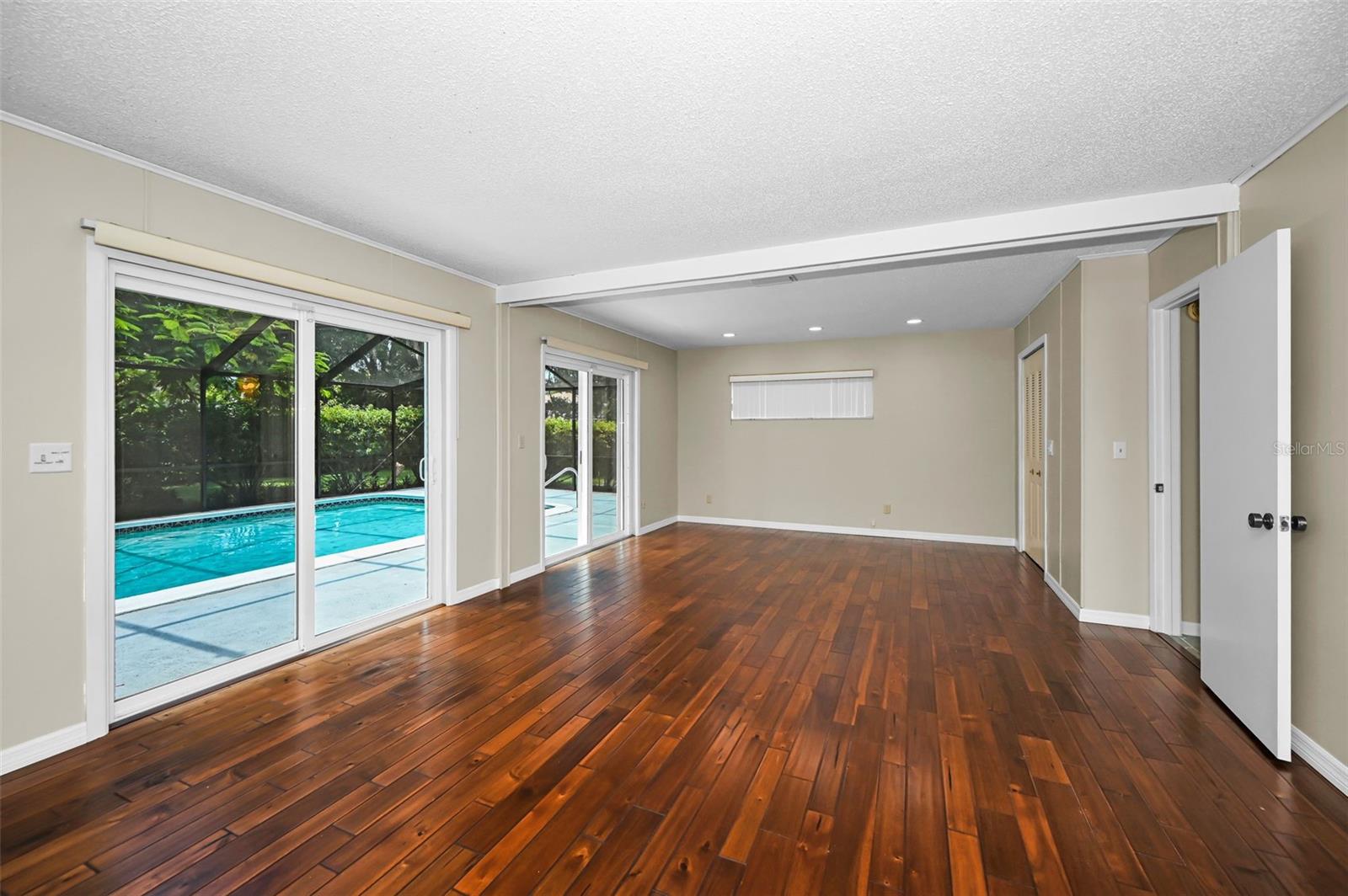 Lower level Family Room with Sliding Glass doors to the pool area