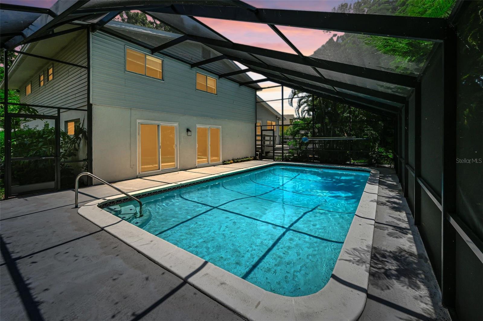 Screen enclosed pool in the twilight hours