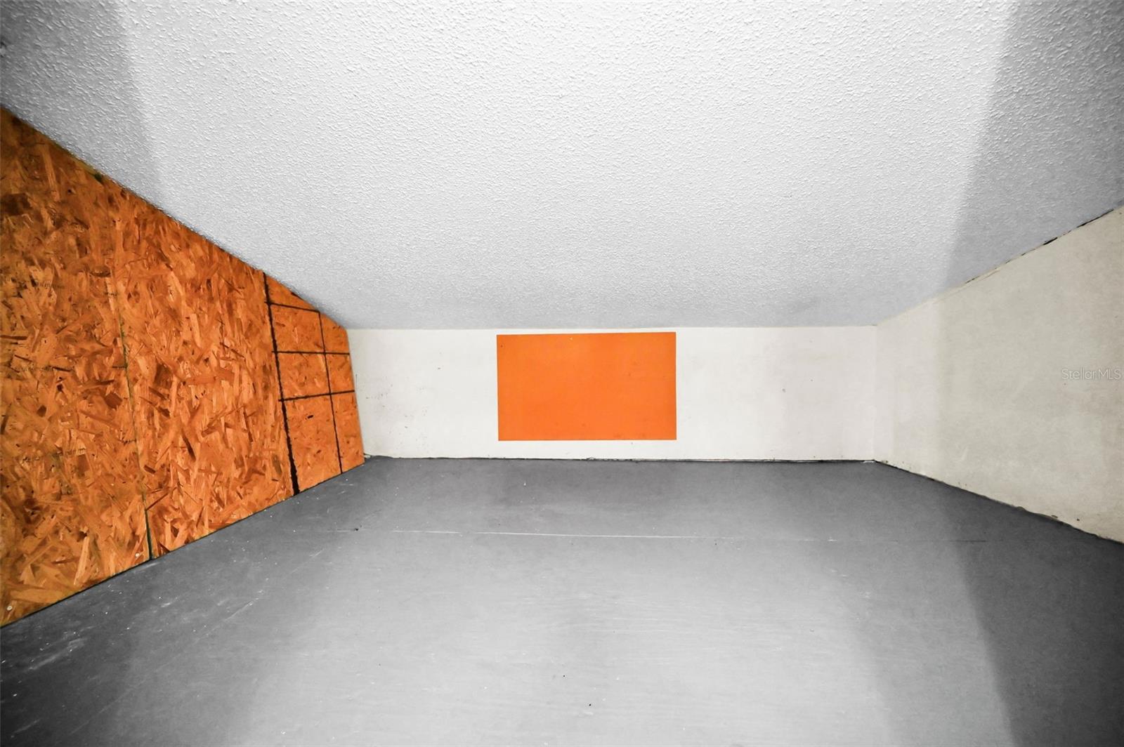 Storage space behind the door of the Primary closet