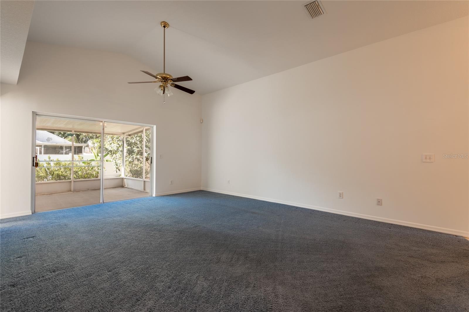 Vaulted ceiling in the living room. Freshly painted interior.