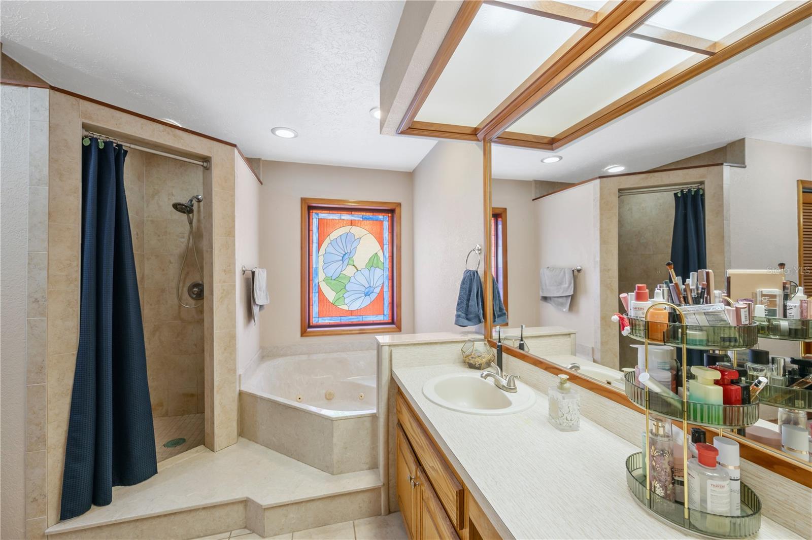 The owner's ensuite has dual sinks on the vanity, a relaxing jetted soaking tub, and a separate walk-in shower.