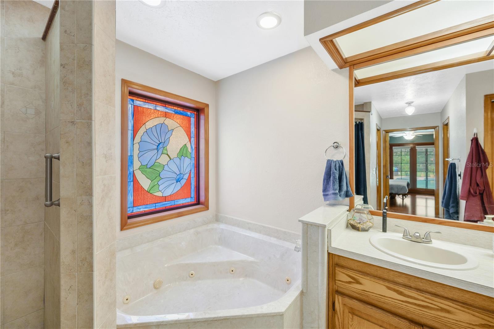 Large corner jetted tub to soak your worries away.
