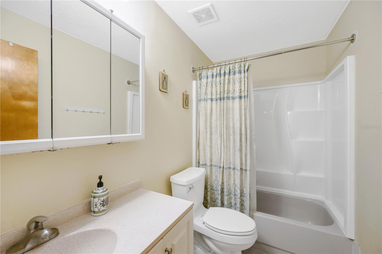 Guest bathroom has a tub/shower.