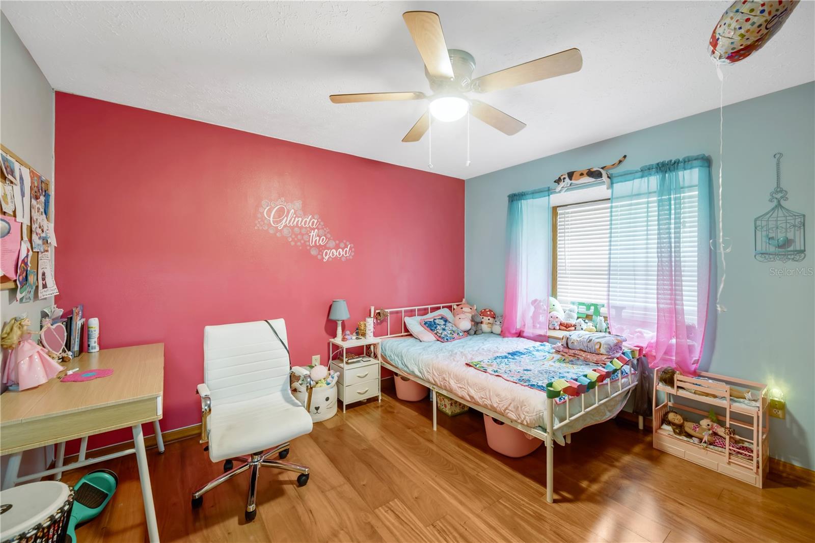 Secondary bedroom #3 shares a full bath and features charming built-in window bench with hidden storage.