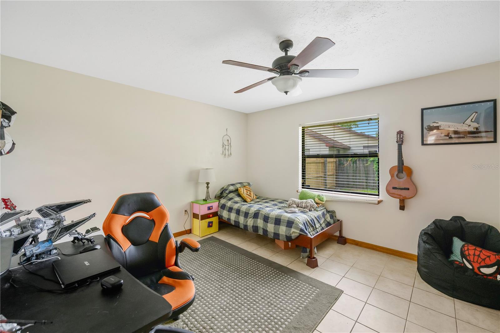 Tucked away at the rear of the home, the fourth bedroom includes two built-in closets and easy access to a full bath.