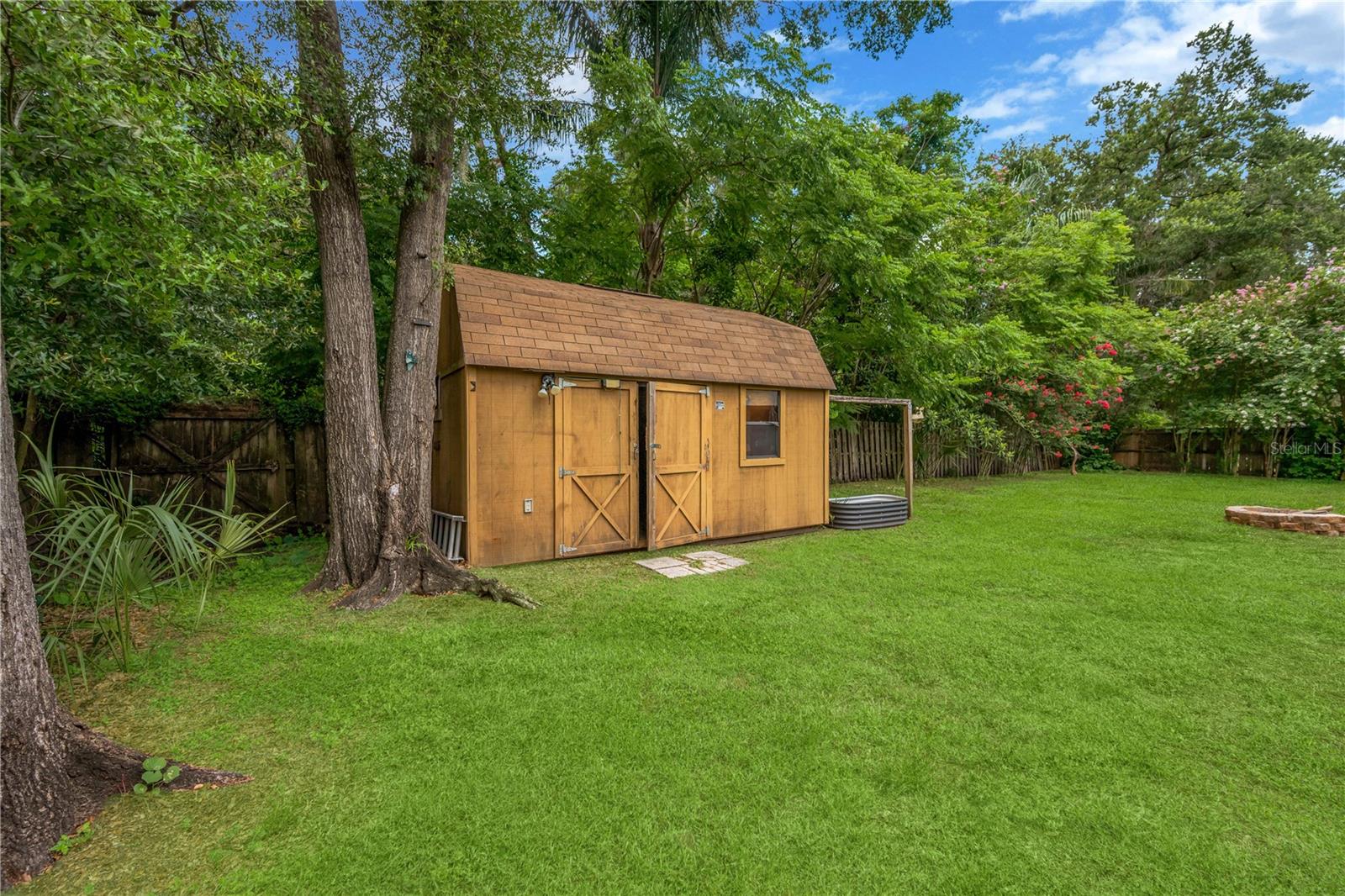 An 11' x 16' storage shed with electricity provides excellent space for hobbies, a workshop, or extra storage.