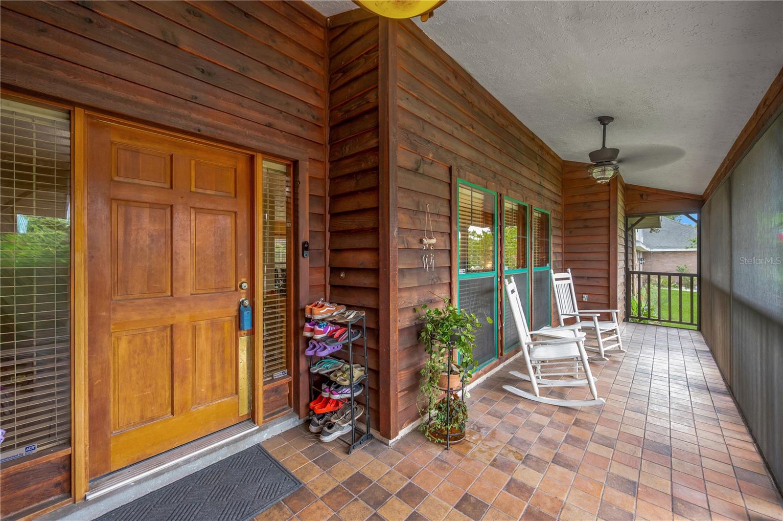 A welcoming screened front porch sets the stage for the warmth you'll find inside.