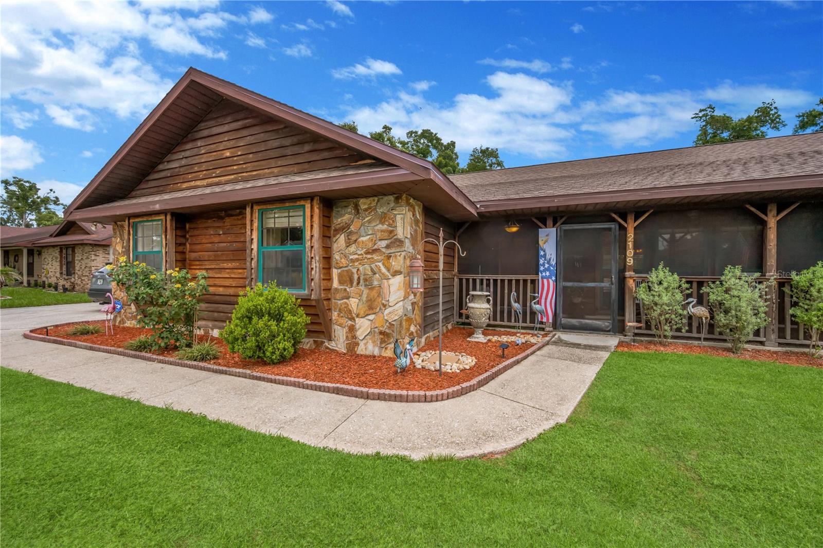 Home is sided with cedar with stone accents.