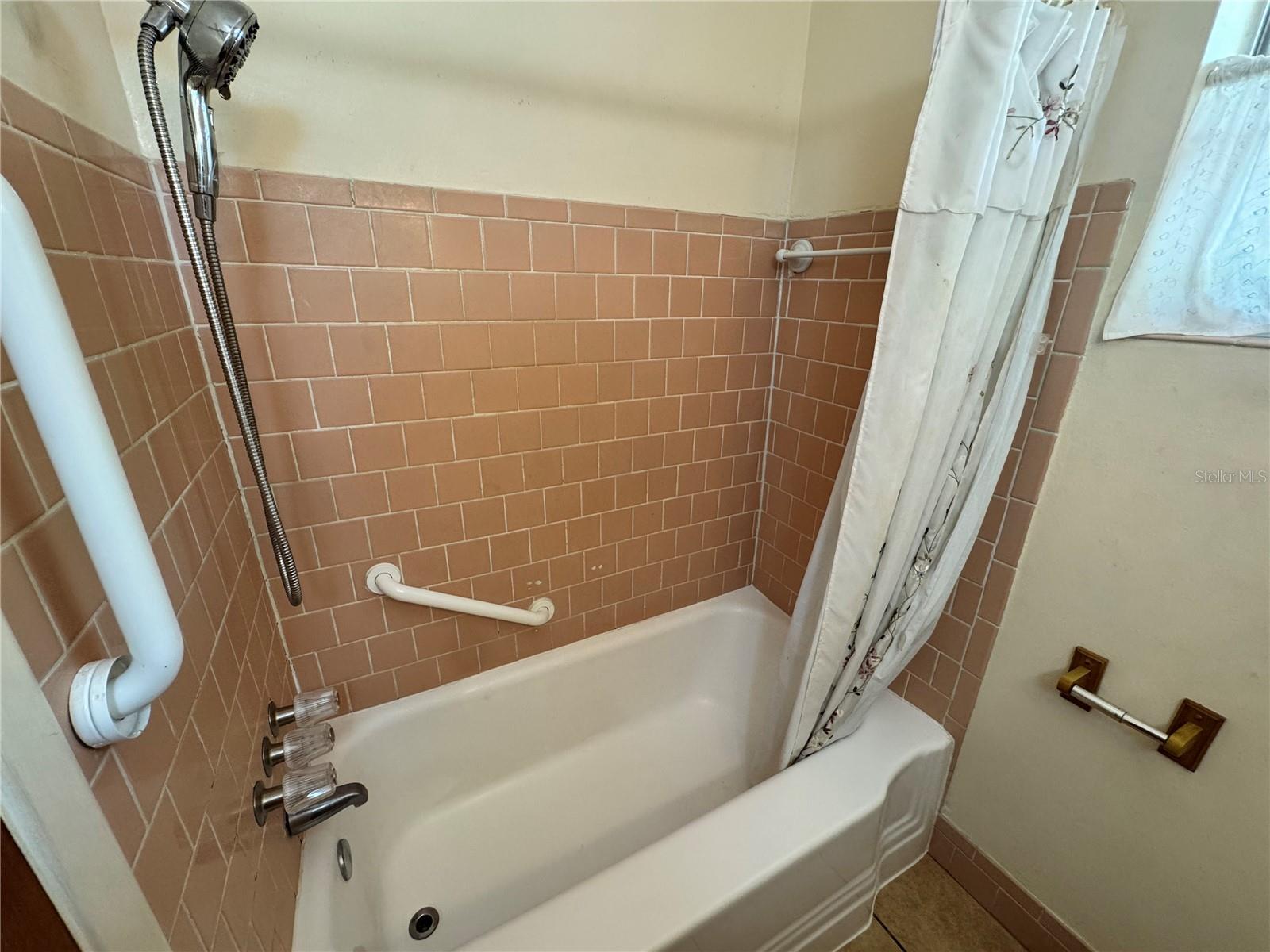 Tub are in full bathroom