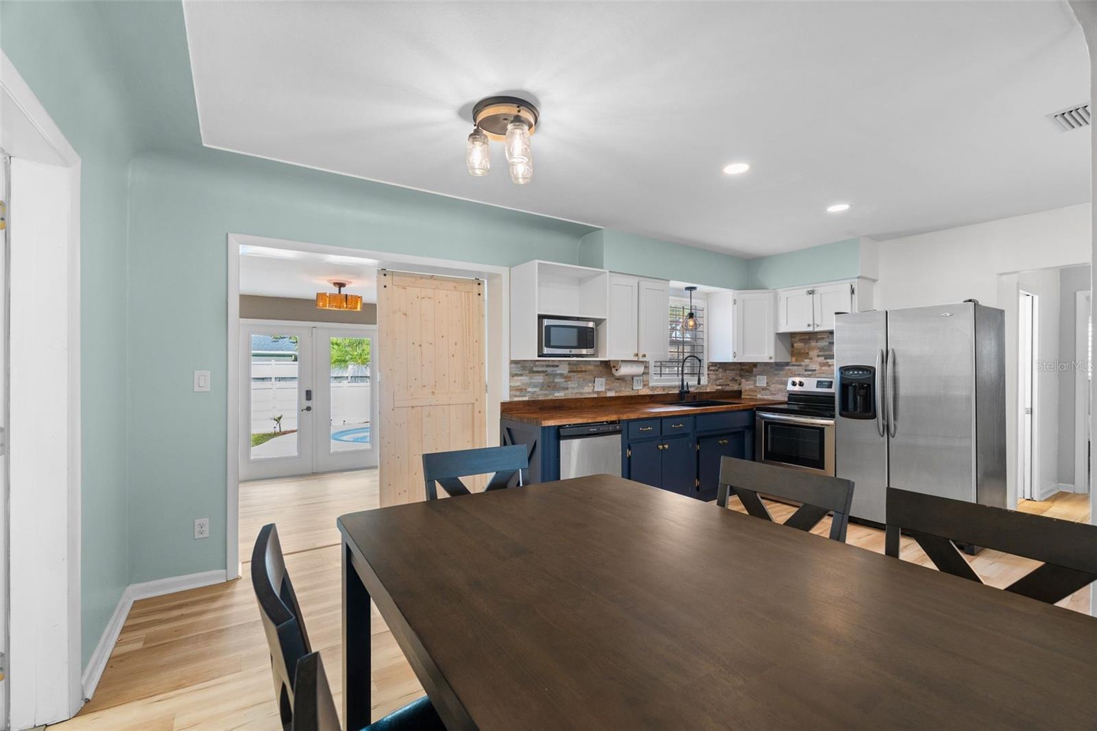 Open floor plan includes great room, dining area and kitchen.