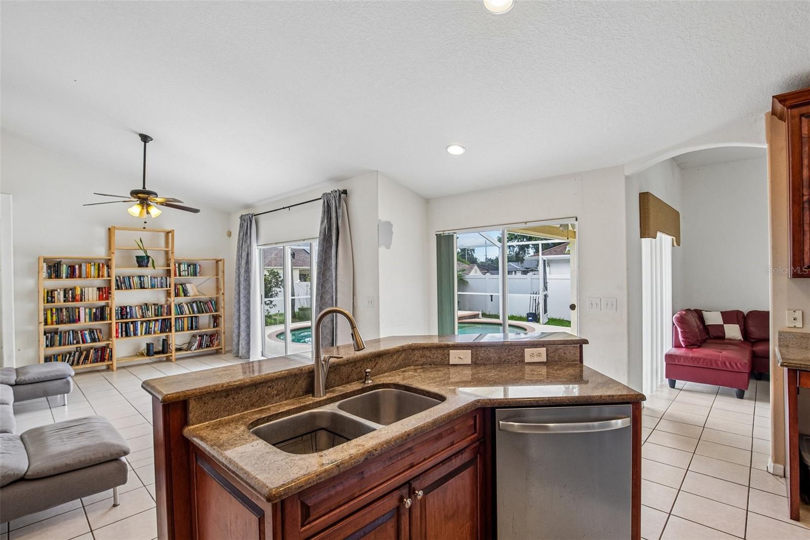 KITCHEN WITH HIGH BAR ALLOWS FOR EXTRA SEATING