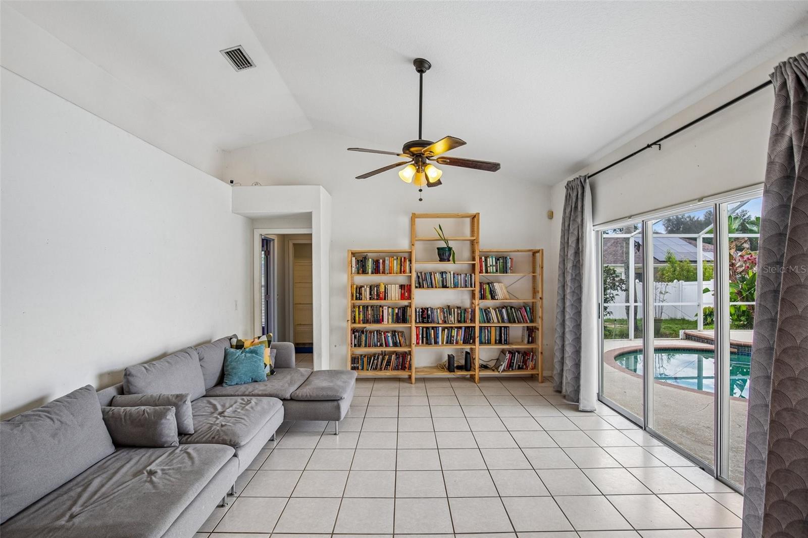 FAMILY ROOM OVER LOOKS POOL