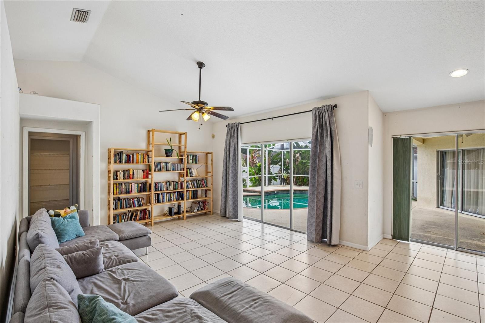 FAMILY ROOM OVER LOOKS POOL