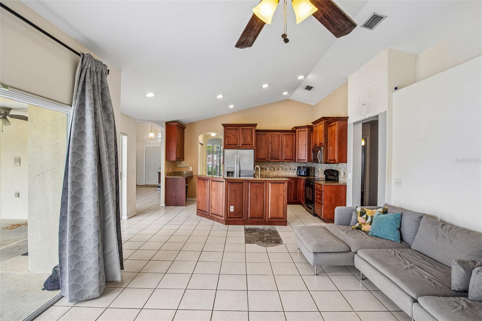 FAMILY ROOM OVER LOOKS POOL