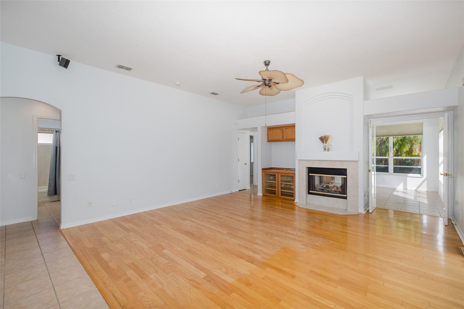 Family Room Features a Fireplace and built-in dry bar