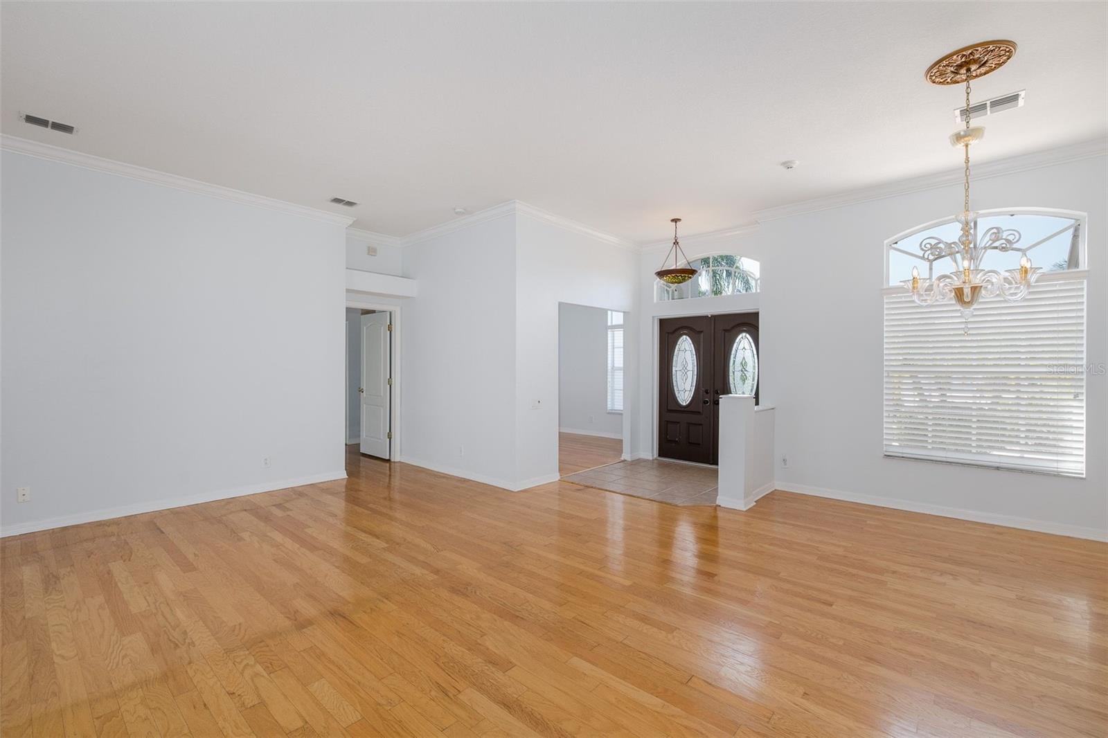Front Entry Opens to Formal Dining and Formal Living Areas