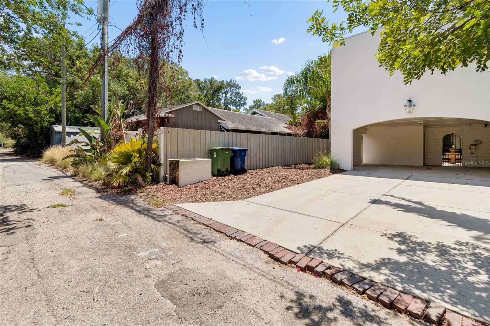 Rare 2 car carport with 2 outside storage rooms and private alleyway pull in