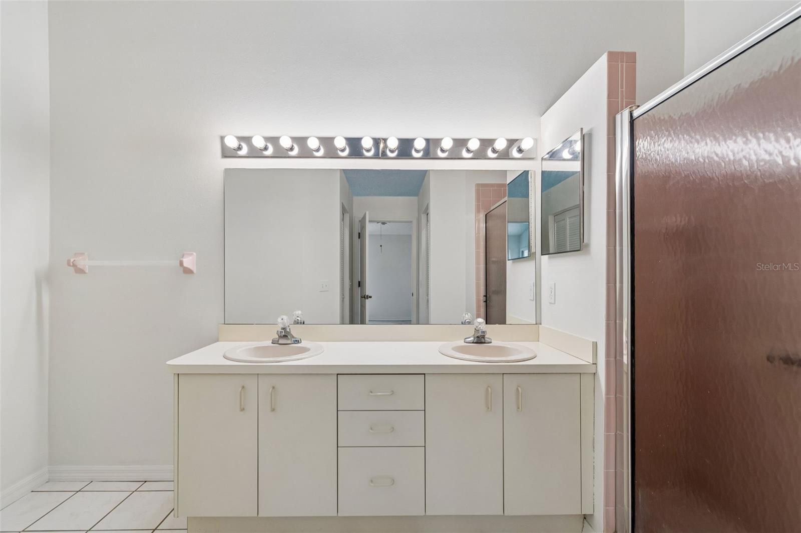 Primary Bathroom with dual sinks, shower