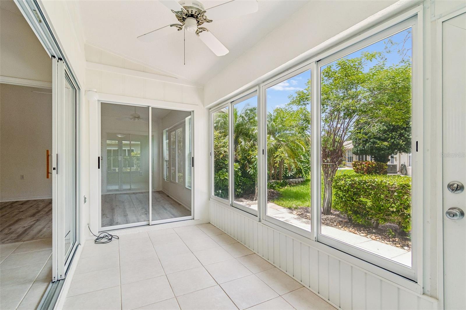 Sun room from Kitchen towards outdoor Patio