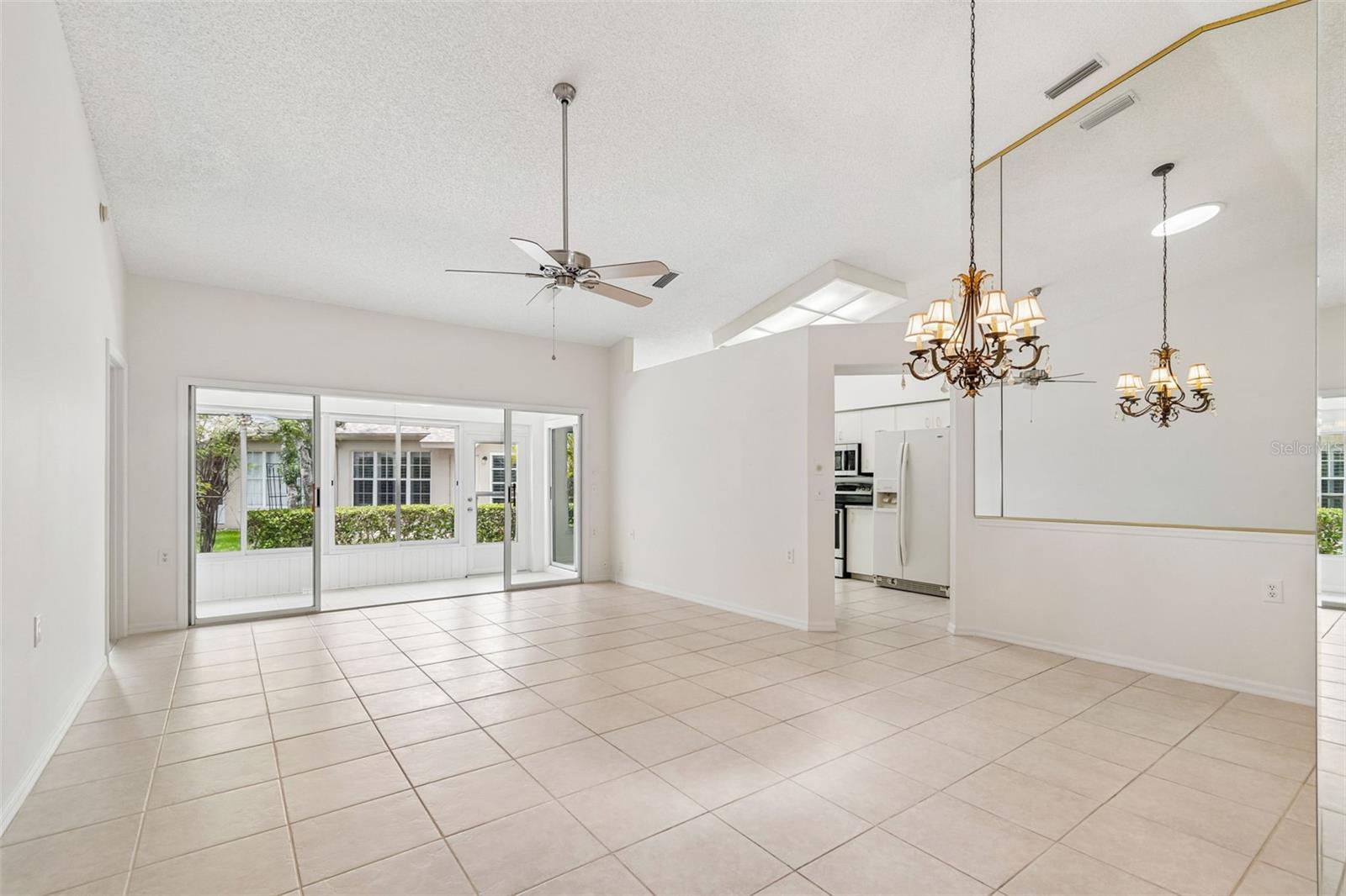 Great Room & Dining Area with sliders to Sun Room