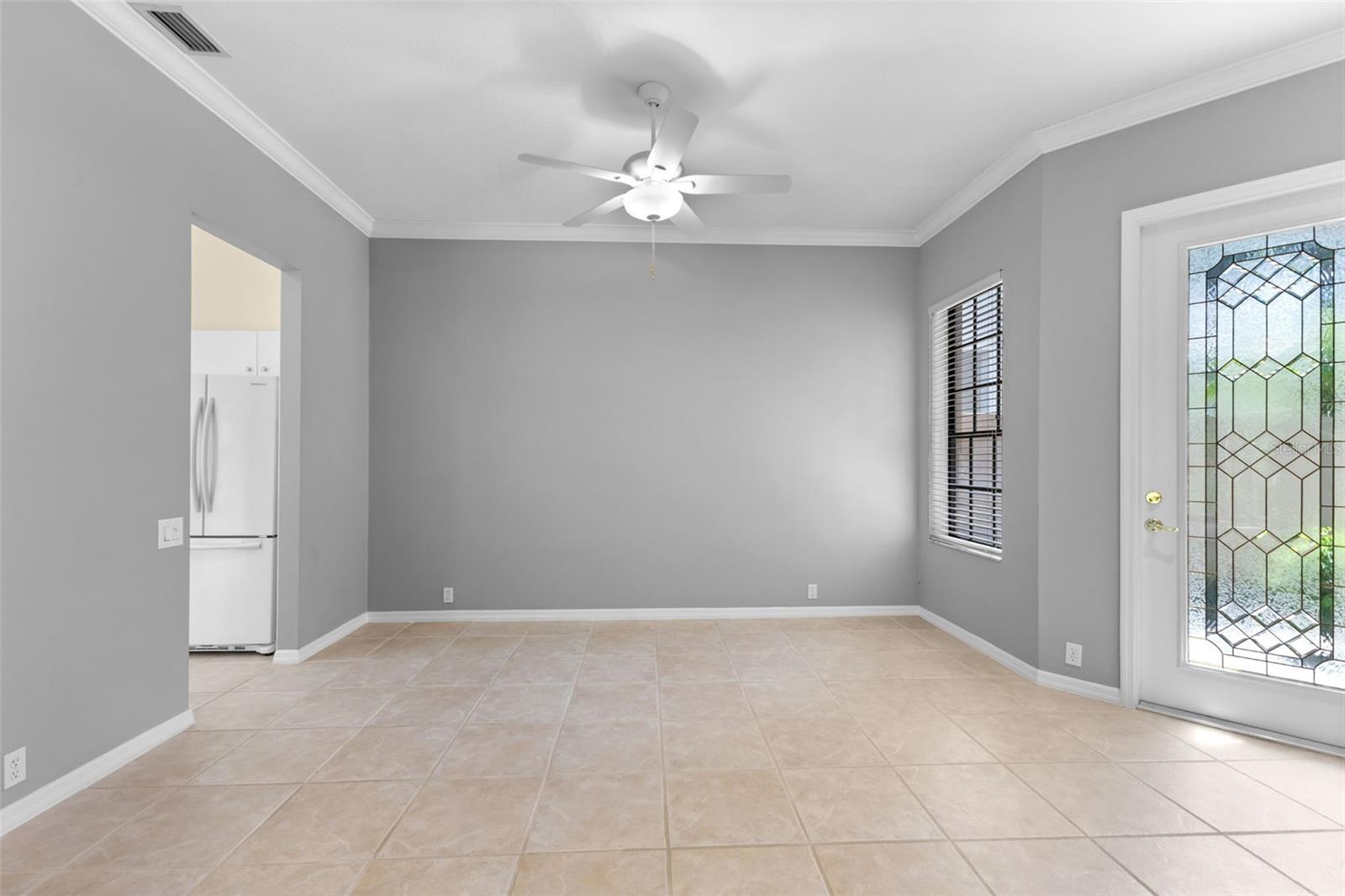 Dedicated dining area perfect for family gatherings while enjoying peaceful conservation views through the surrounding windows.