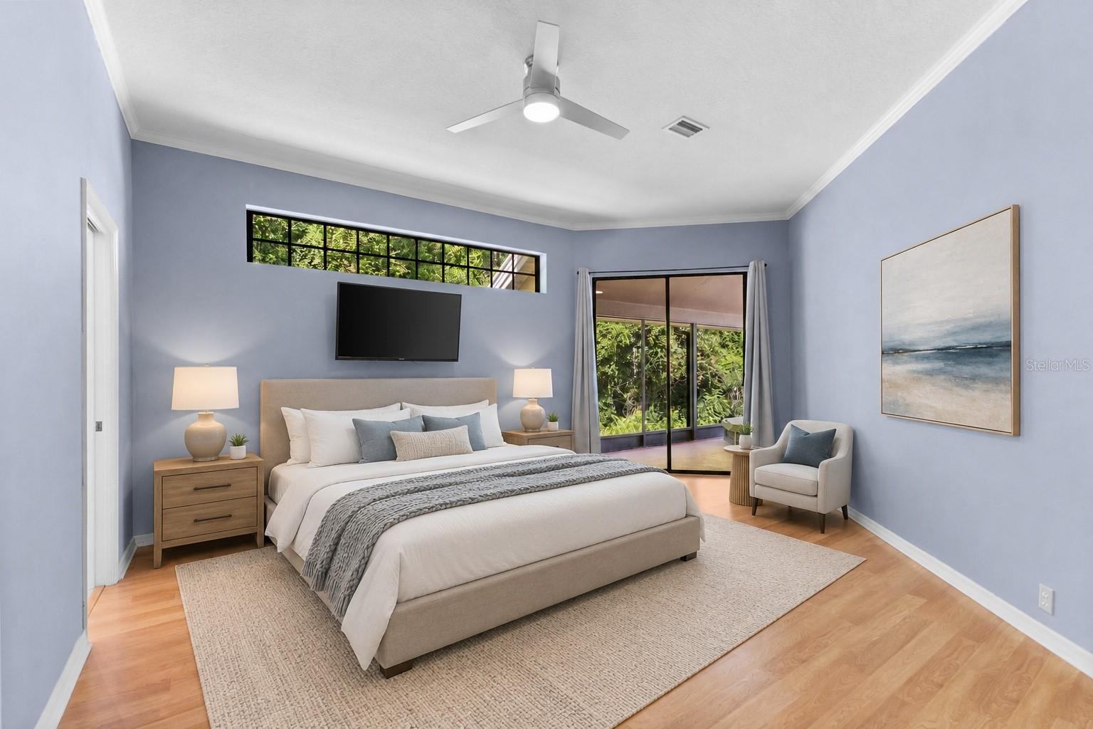 Spacious owner's suite with large windows framing peaceful nature views and plenty of room for a king-size bedroom set.