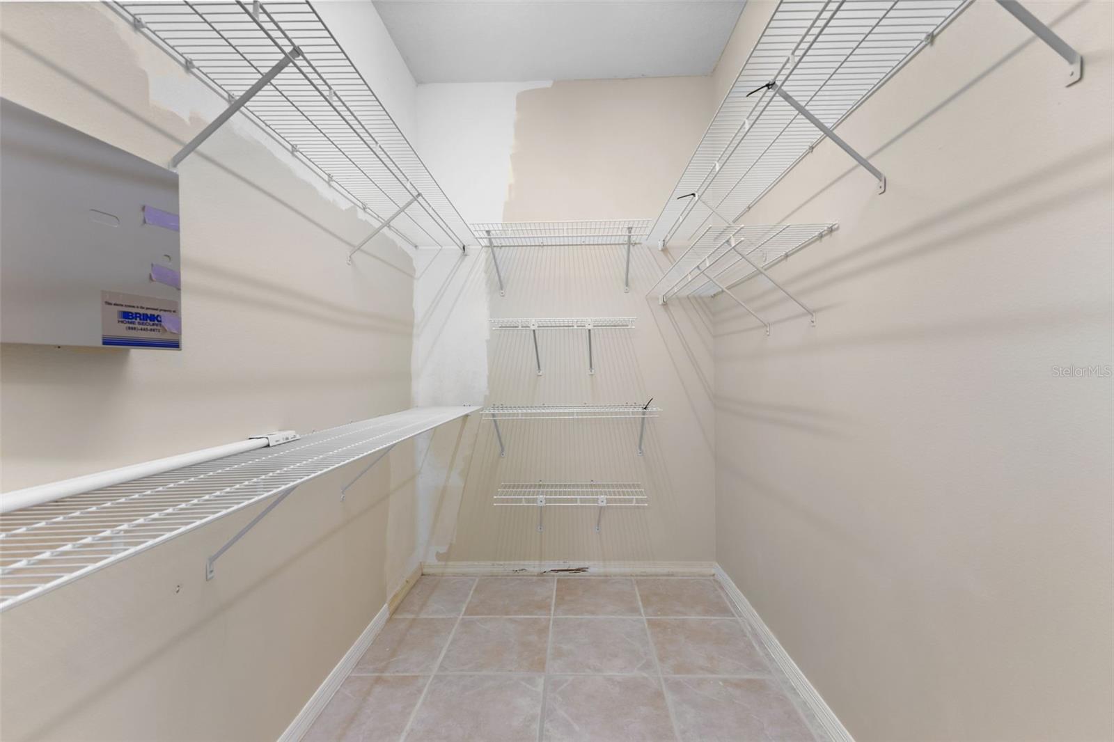 Large walk-in closet provides abundant storage and organization.