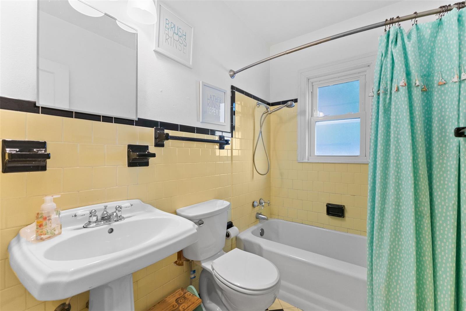 Charming full bath with tub/shower combo and vintage character — clean, bright, and move-in ready.