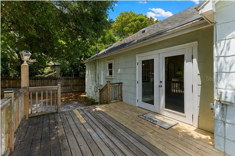 French doors open directly onto the deck, creating seamless indoor-outdoor flow, with off-street parking just steps away.