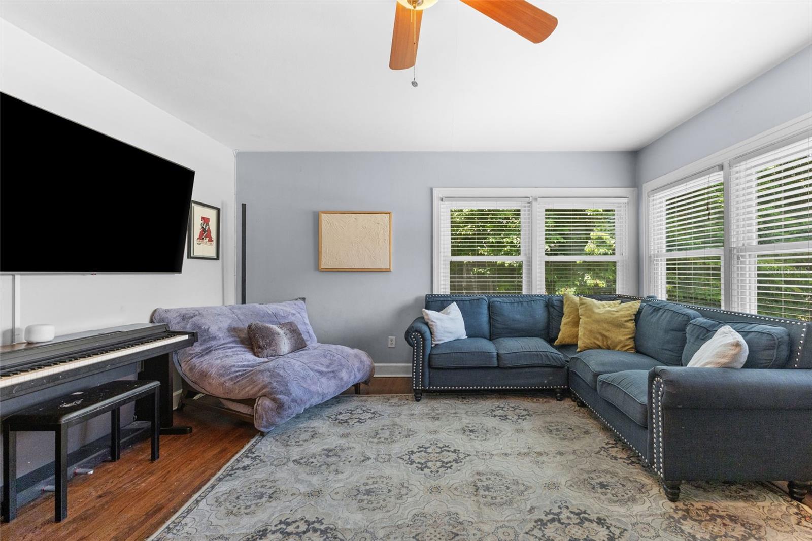 Generous living area with room for a full sectional — bright, comfortable, and made for everyday living.