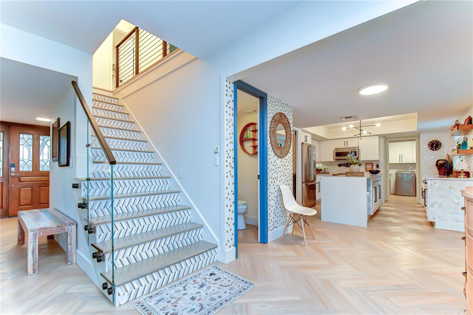 Designer staircase with custom tile detailing.