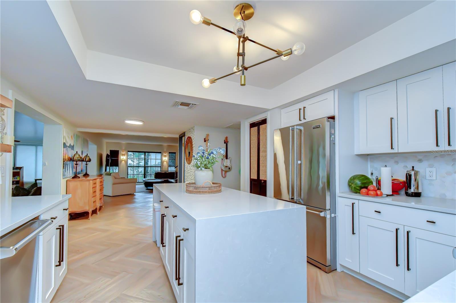 Dramatic waterfall-edge quartz countertops.