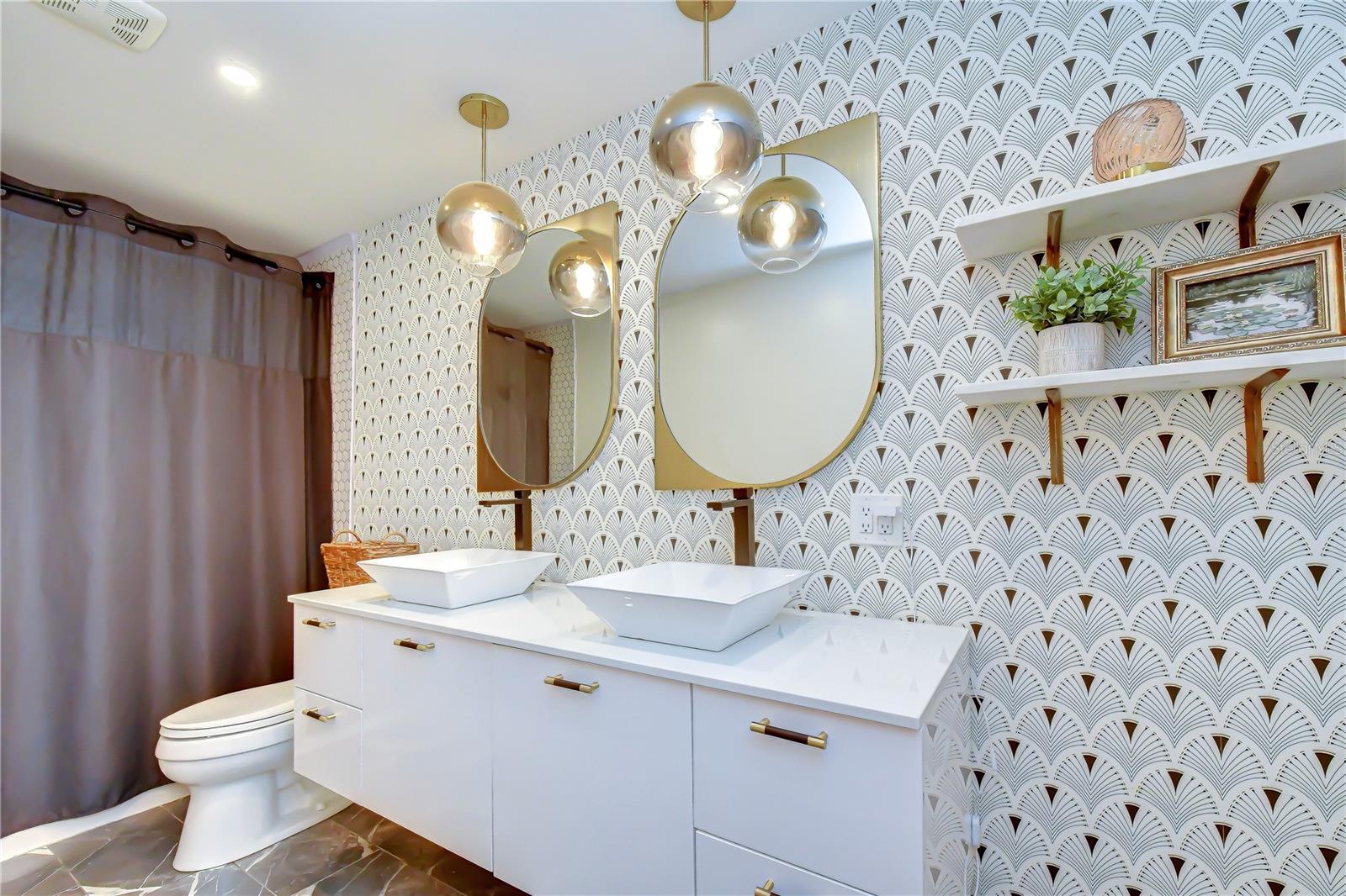 Beautifully remodeled bathroom with custom cabinetry.